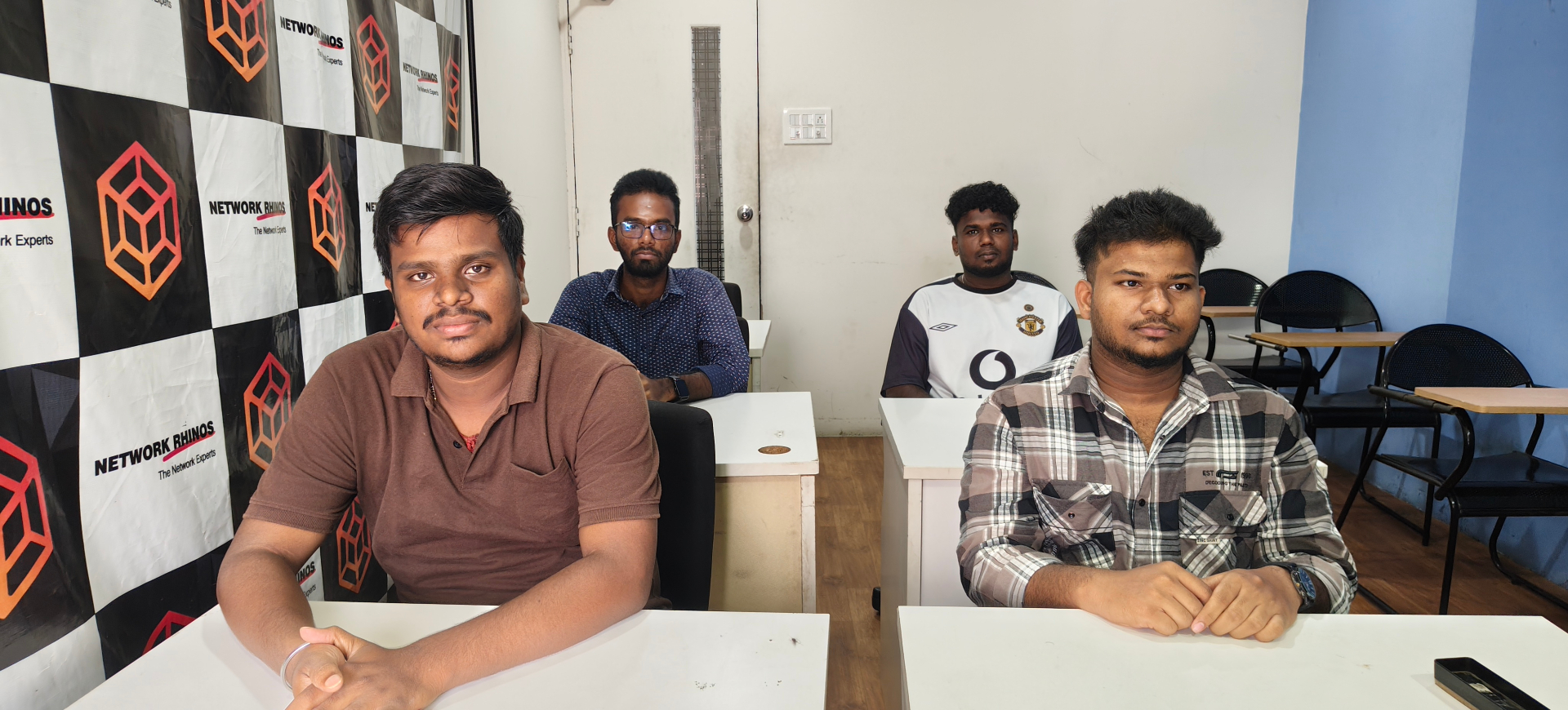 Network Rhinos classroom batch — August 2026 networking students at desks